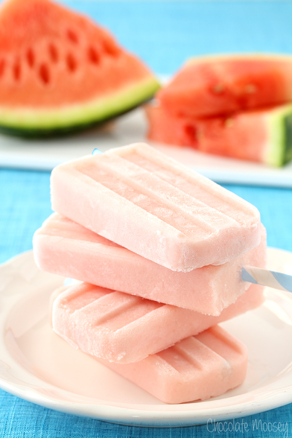 Watermelon Popsicles stacked on white plate