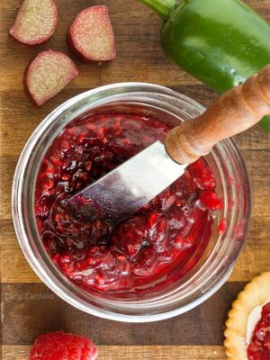 Jar of raspberry jalapeno jam with knife