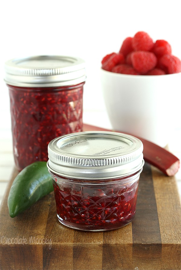 Raspberry Jalapeno Jam in jars on a cutting board