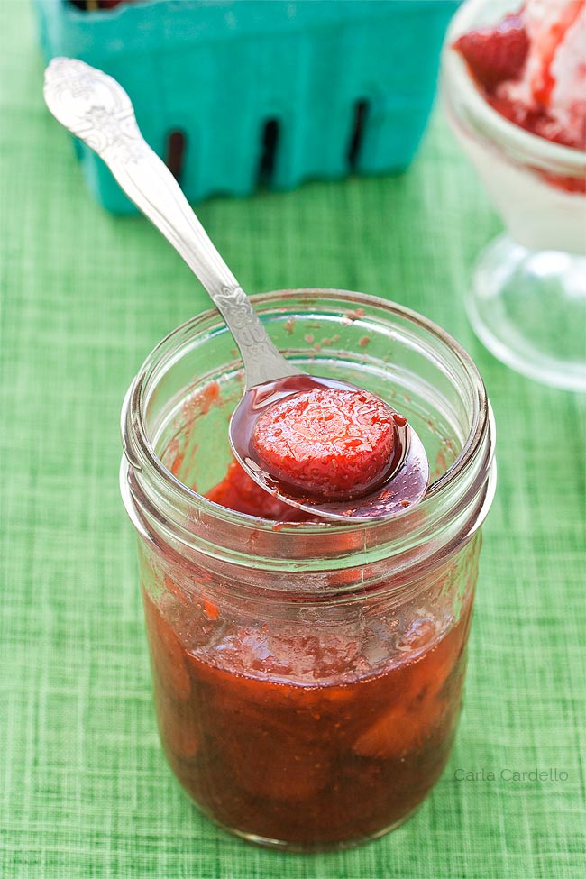 Strawberry Sauce on a spoon over a jar