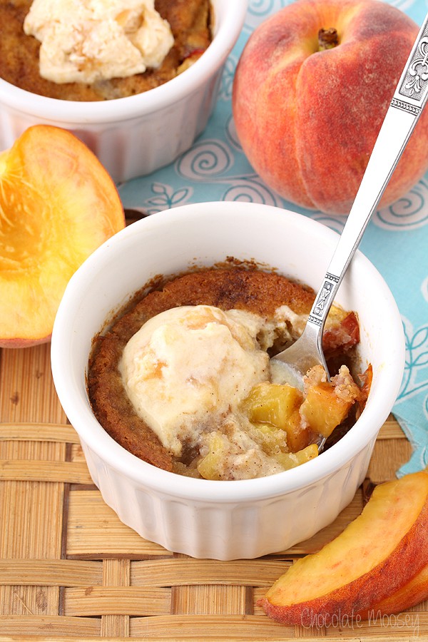 White ramekin with peach cobbler inside