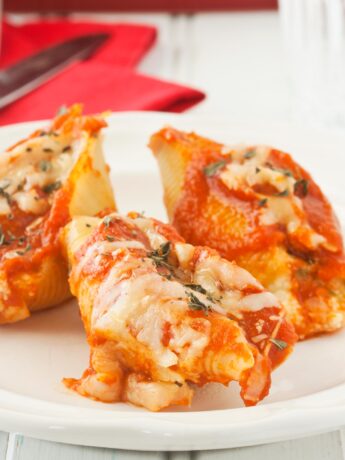 Close up of cheese stuffed shells with ricotta cheese, mozzarella, and Parmesan