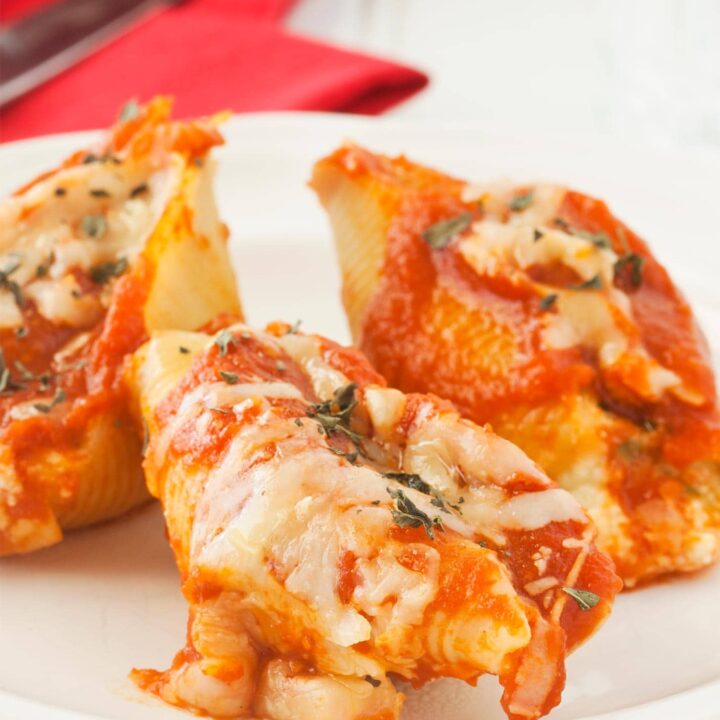 Close up of cheese stuffed shells with ricotta cheese, mozzarella, and Parmesan