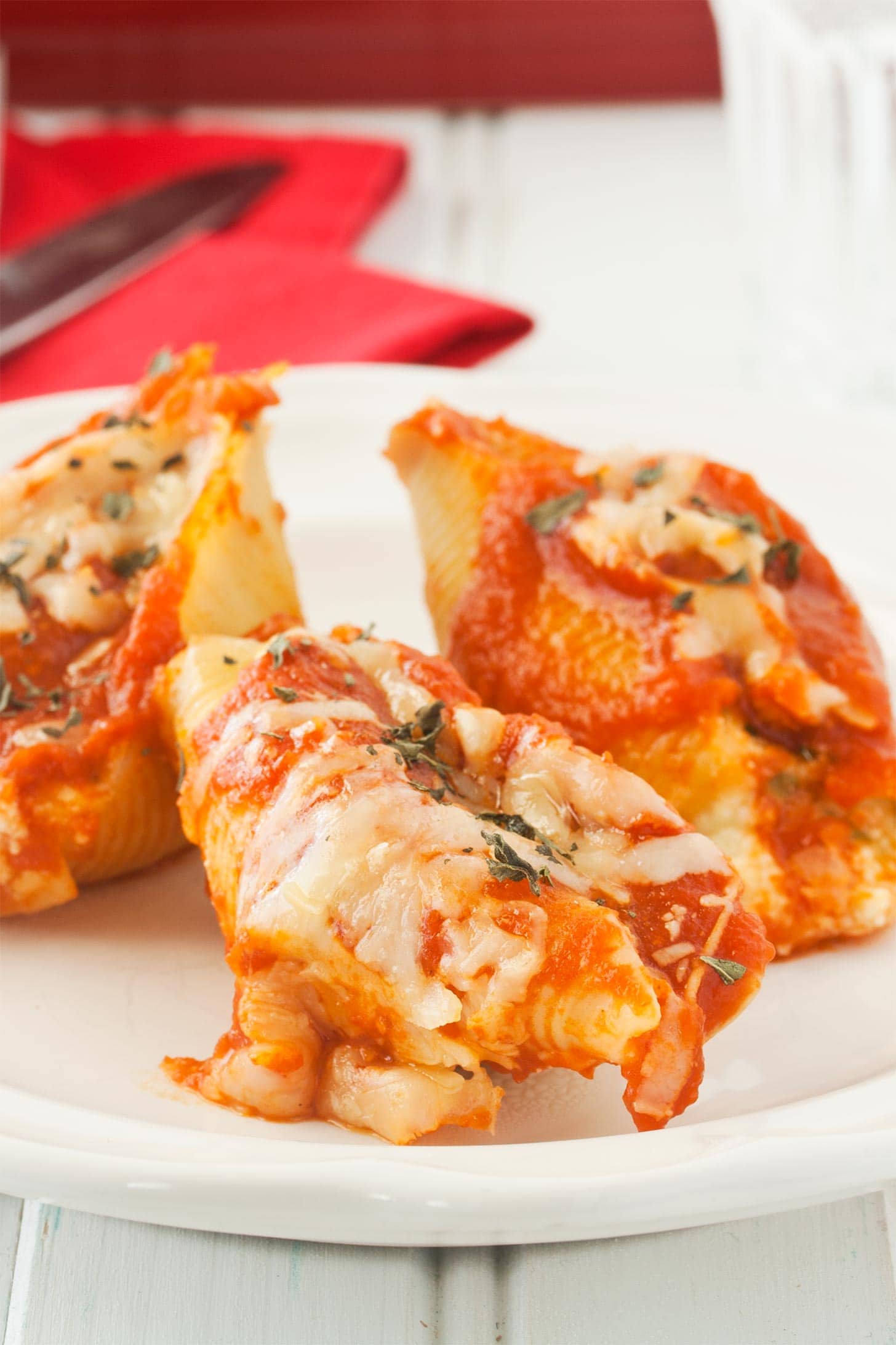 Close up of cheese stuffed shells with ricotta cheese, mozzarella, and Parmesan