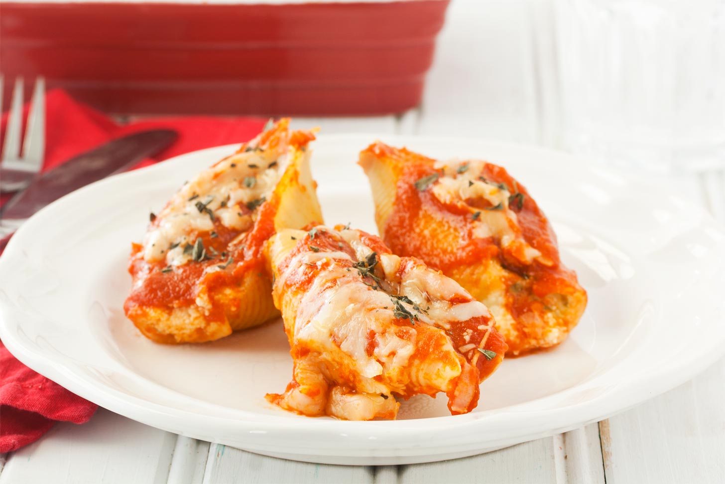Cheese stuffed shells recipe served on white plate