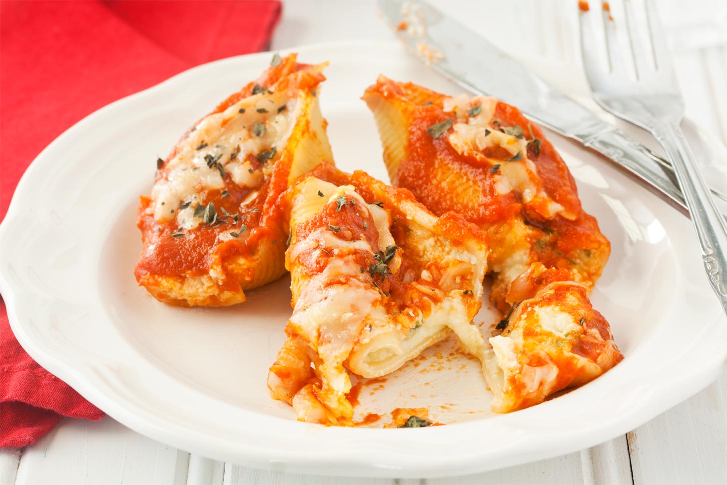 Eating stuffed cheese shells with ricotta