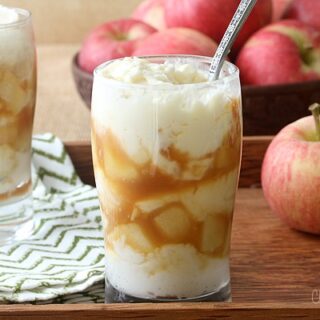 Caramel Apple Cheesecake with a spoon in a parfait glass