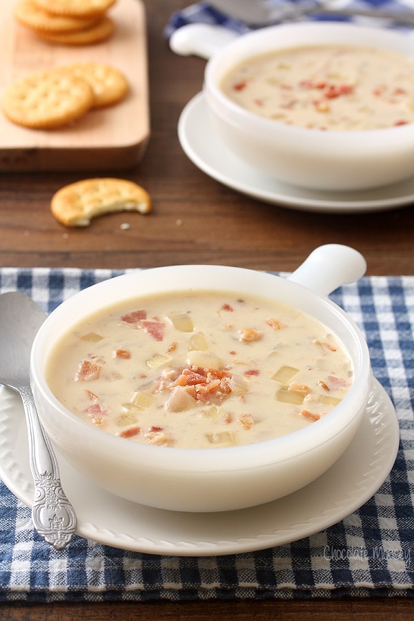 Creamy onion soup in white bowl with handle