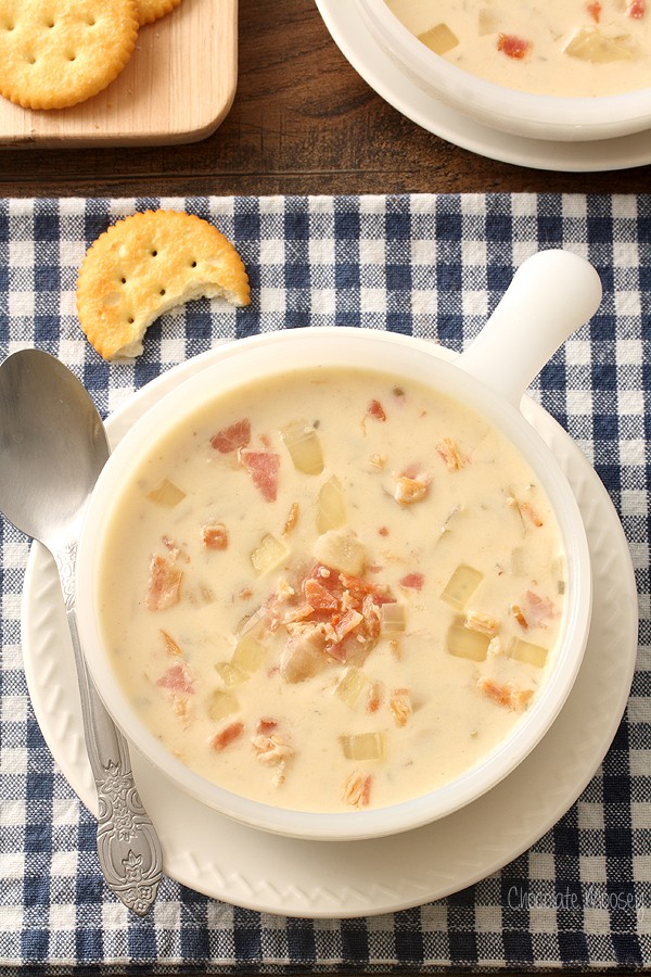 Cream of onion soup in a white bowl with blue checkered linen