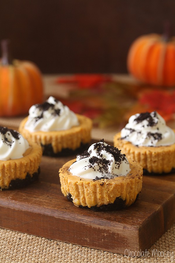 Oreo Pumpkin Cheesecakes on a cutting board