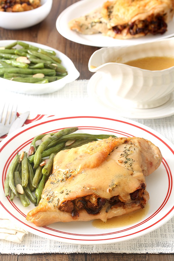 Stuffed turkey breast on plate with green beans