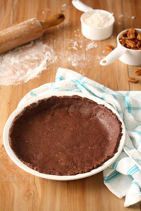 Chocolate pie crust rolled out into white pie plate