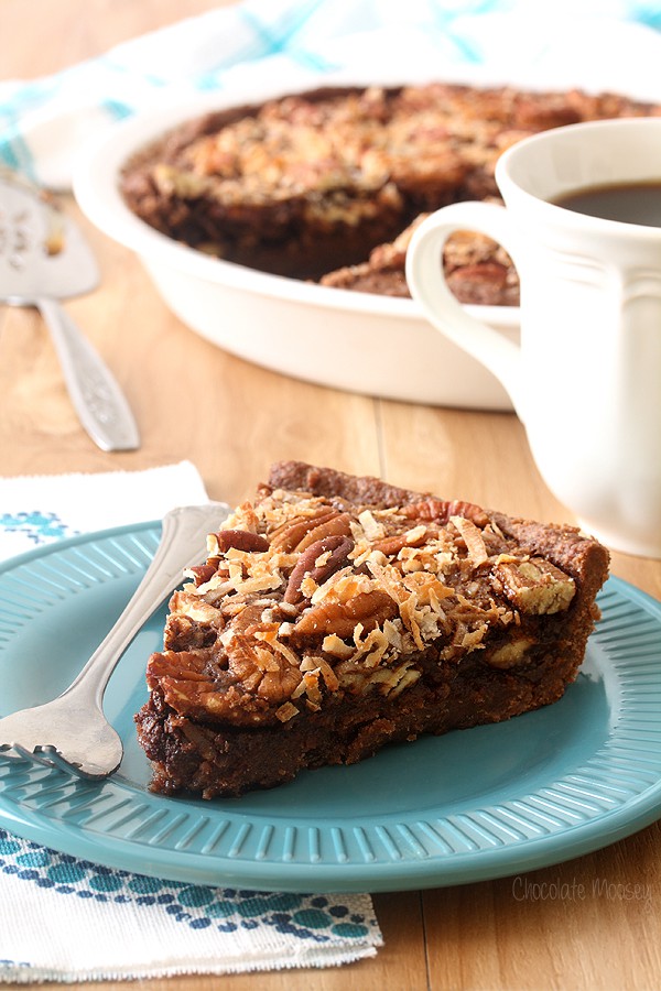 Slice of German Chocolate Pecan Pie on teal plate