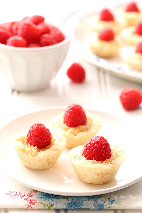 Raspberry Coconut Mini Pies brings a bit of elegance to dessert tables with homemade pie crust, coconut pudding, and sweet whole raspberries.