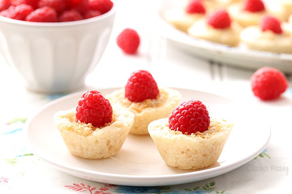 Raspberry Coconut Mini Pies brings a bit of elegance to dessert tables with homemade pie crust, coconut pudding, and sweet whole raspberries