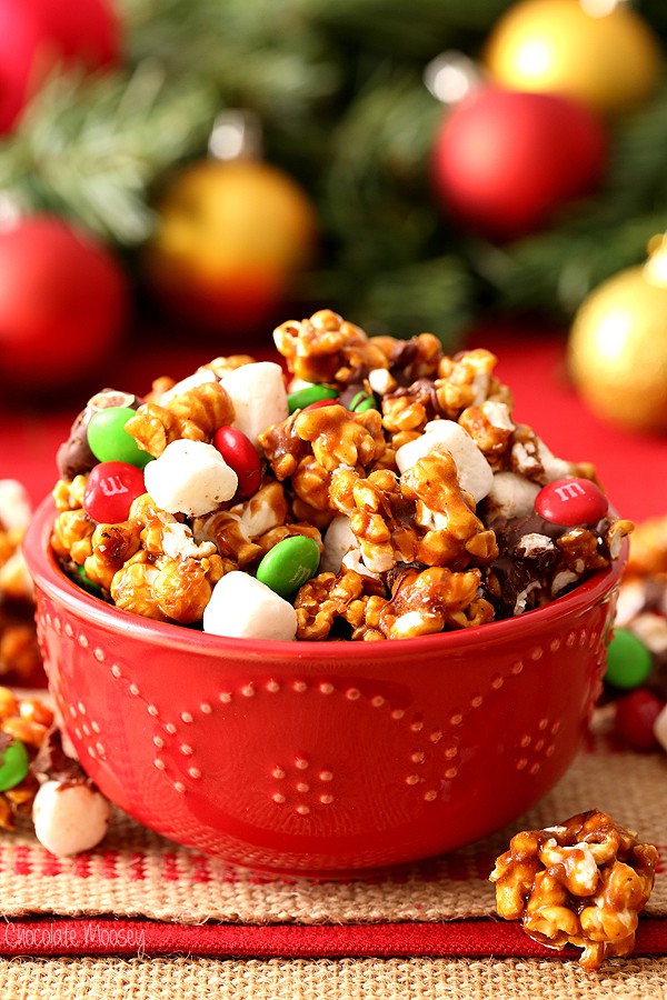 Christmas Popcorn in red bowl with mini marshmallows, M&Ms, and chocolate