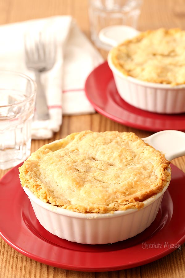 Chicken Pot Pie For Two in ramekins on red plates