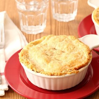 Chicken Pot Pie For Two in ramekins on red plates