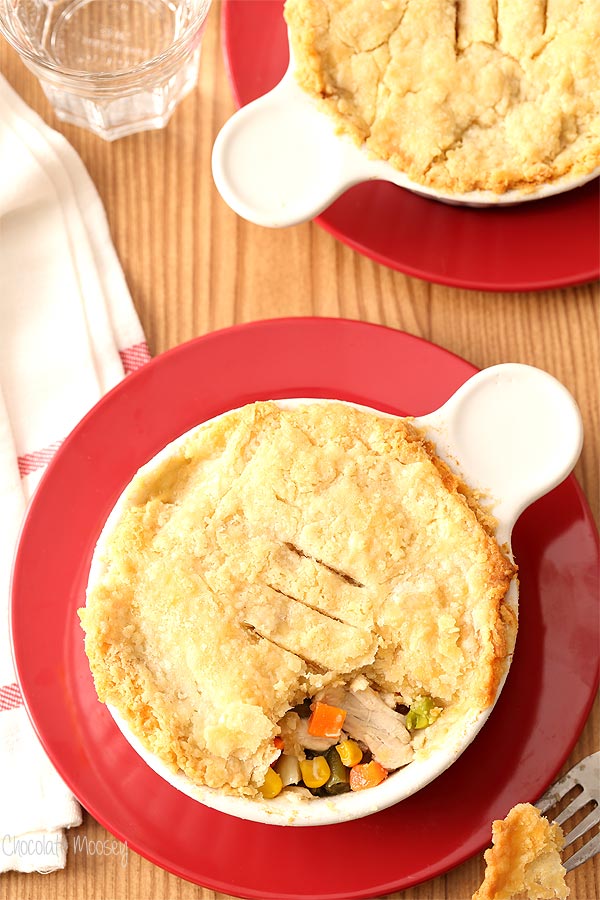 Ramekin Chicken Pot Pie on red plate with fork taking a bite