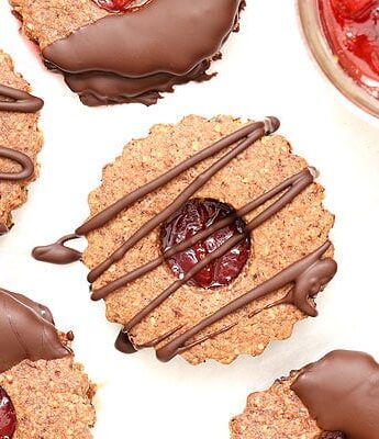 Chocolate Covered Strawberry Linzer Cookies made with hazelnut flour and strawberry jam