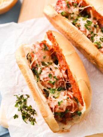 Meatball Parm Sub ready to eat on a cutting board