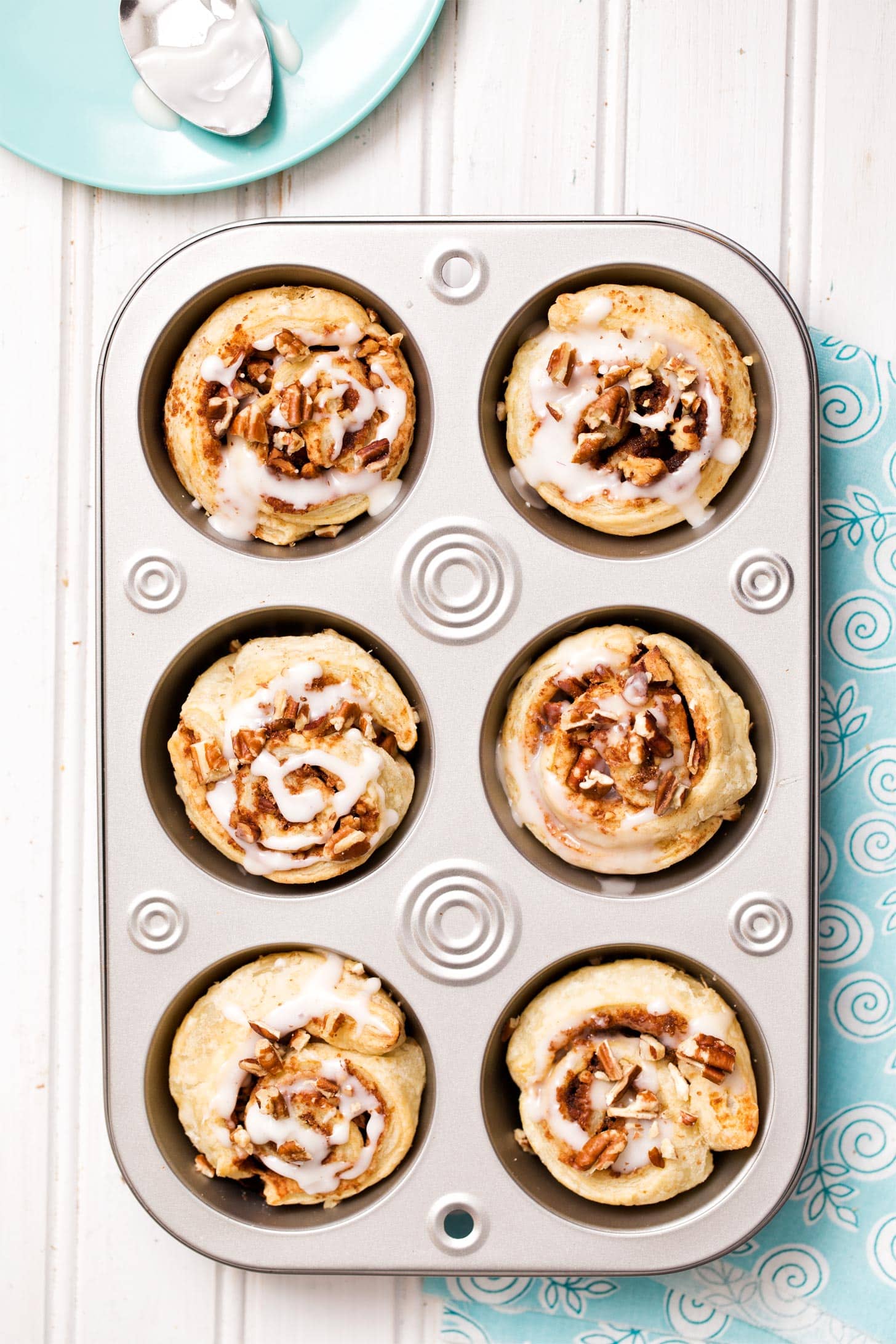 Puff pastry cinnamon rolls in a muffin pan