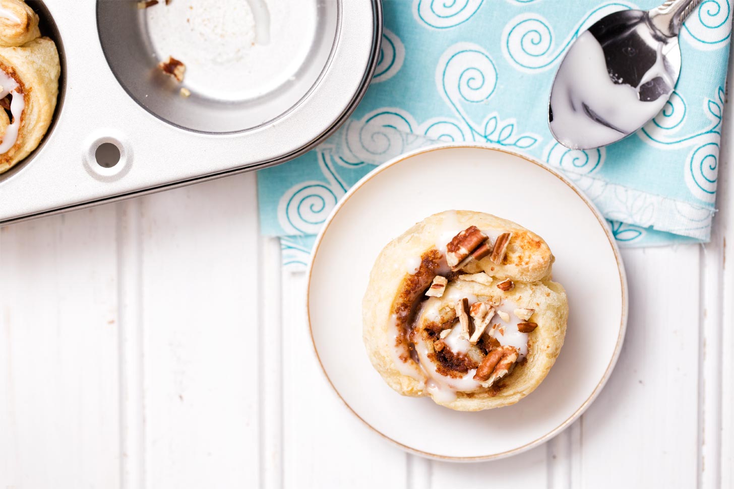 Puff pastry cinnamon roll on white plate