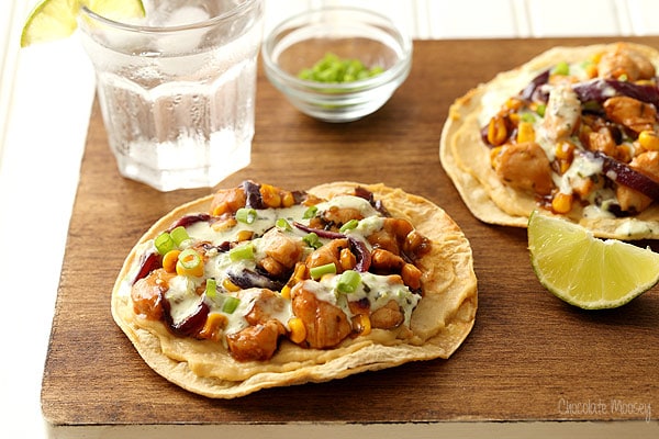 Barbecue chicken and corn on top of oven baked tostadas with hummus