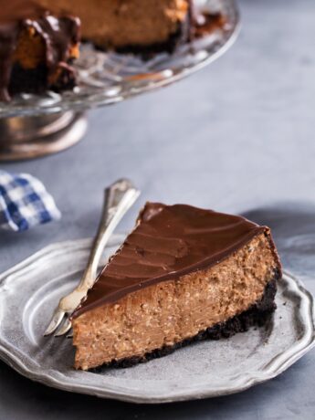 Slice of chocolate cheesecake with oreo crust