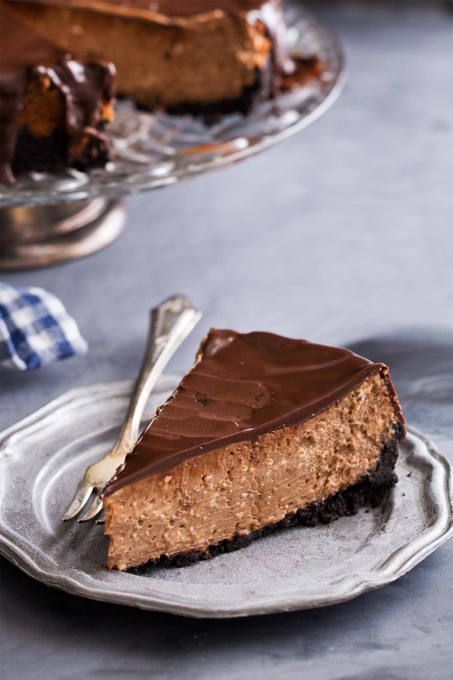 Slice of chocolate cheesecake with oreo crust