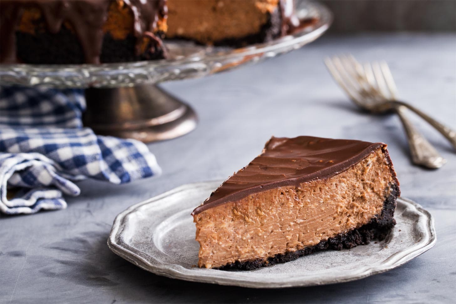 Slice of triple chocolate cheesecake on plate