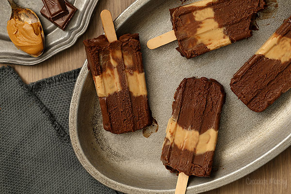 Chocolate Peanut Butter Fudgesicles that taste like eating a peanut butter cup on a stick