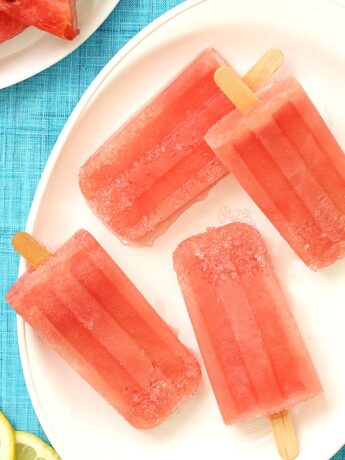 Close Up of Watermelon Margarita Popsicles on a white plate
