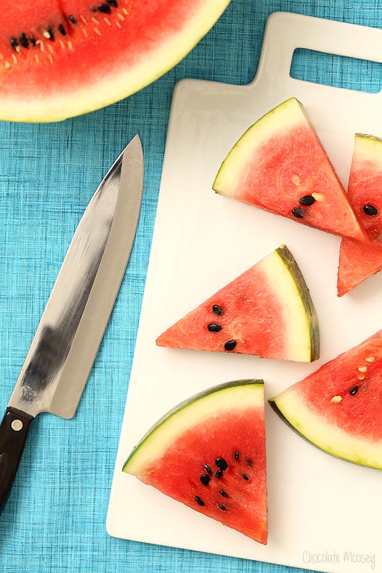 Watermelon slices on cutting board