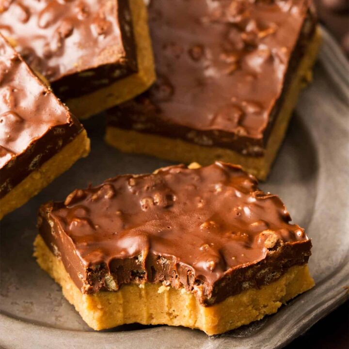 Close up of no bake chocolate peanut butter bars with bite taken