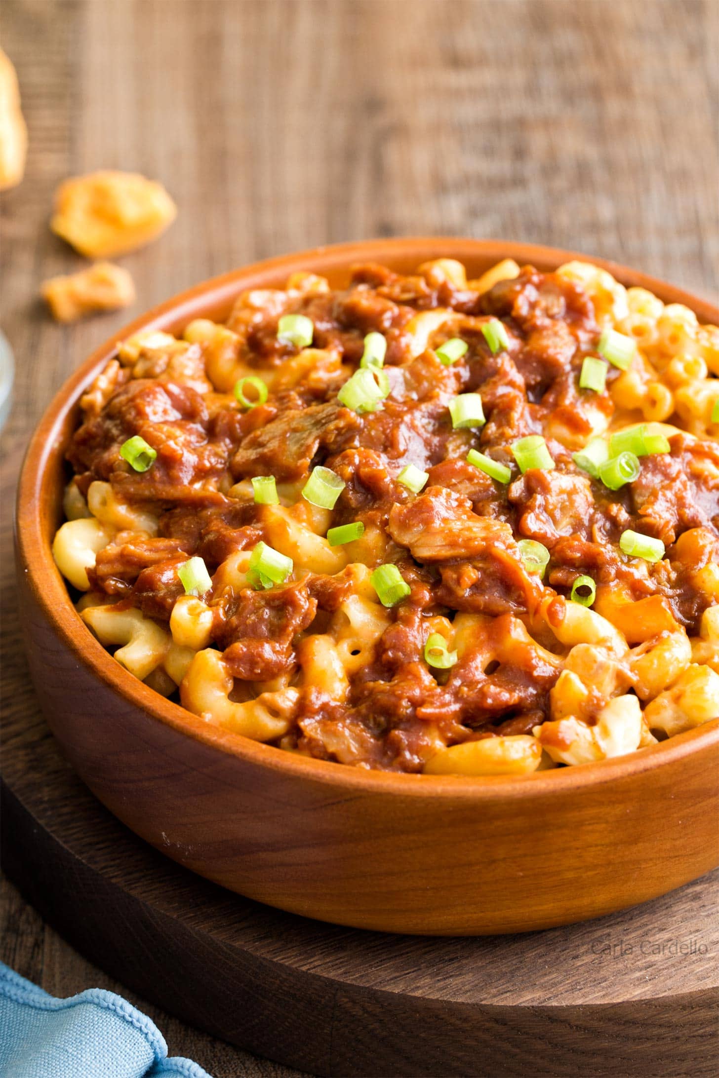 Close up of pulled pork mac and cheese in brown bowl