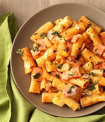 Hawaiian Pizza Pasta made with homemade tomato sauce, ham, pineapple, and mozzarella cheese