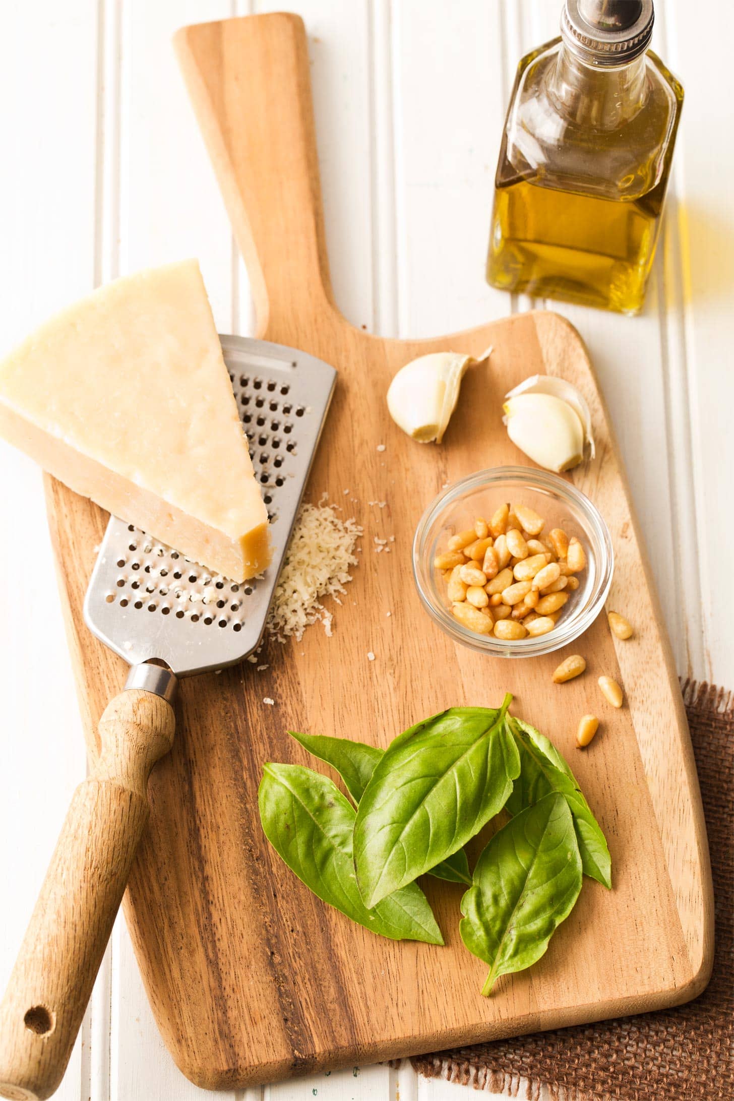 Making basil pesto for macaroni with pesto sauce