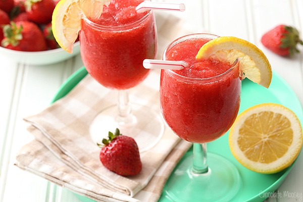 Two glasses strawberry slush on turquoise tray