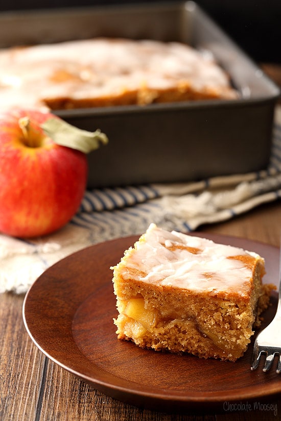 Slice of Apple Fritter Cake on wooden plate