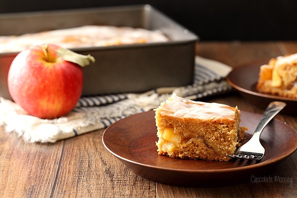 Slice of Apple Fritter Cake on wooden plate