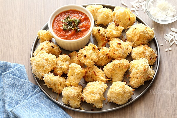 Coconut Crusted Baked Cauliflower Bites with homemade marinara sauce