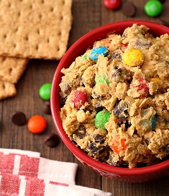 Monster Cookie Dough Dip with peanut butter, M&Ms, chocolate chips, and oats