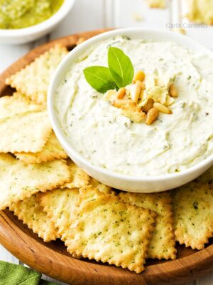 Pesto Dip in white bowl with chips
