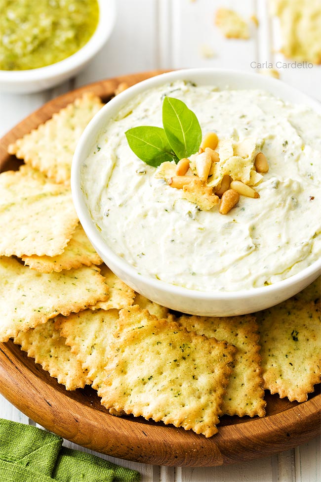 Pesto Dip in white bowl with chips