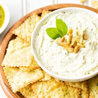 Pesto Dip in white bowl with chips