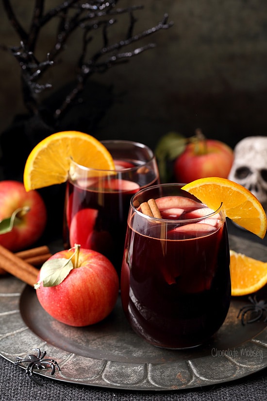 Apple Cider Sangria on pewter plate with Halloween decorations