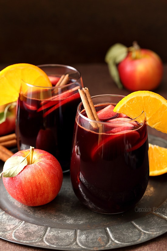 Apple Cider Sangria on a silver plate with apples