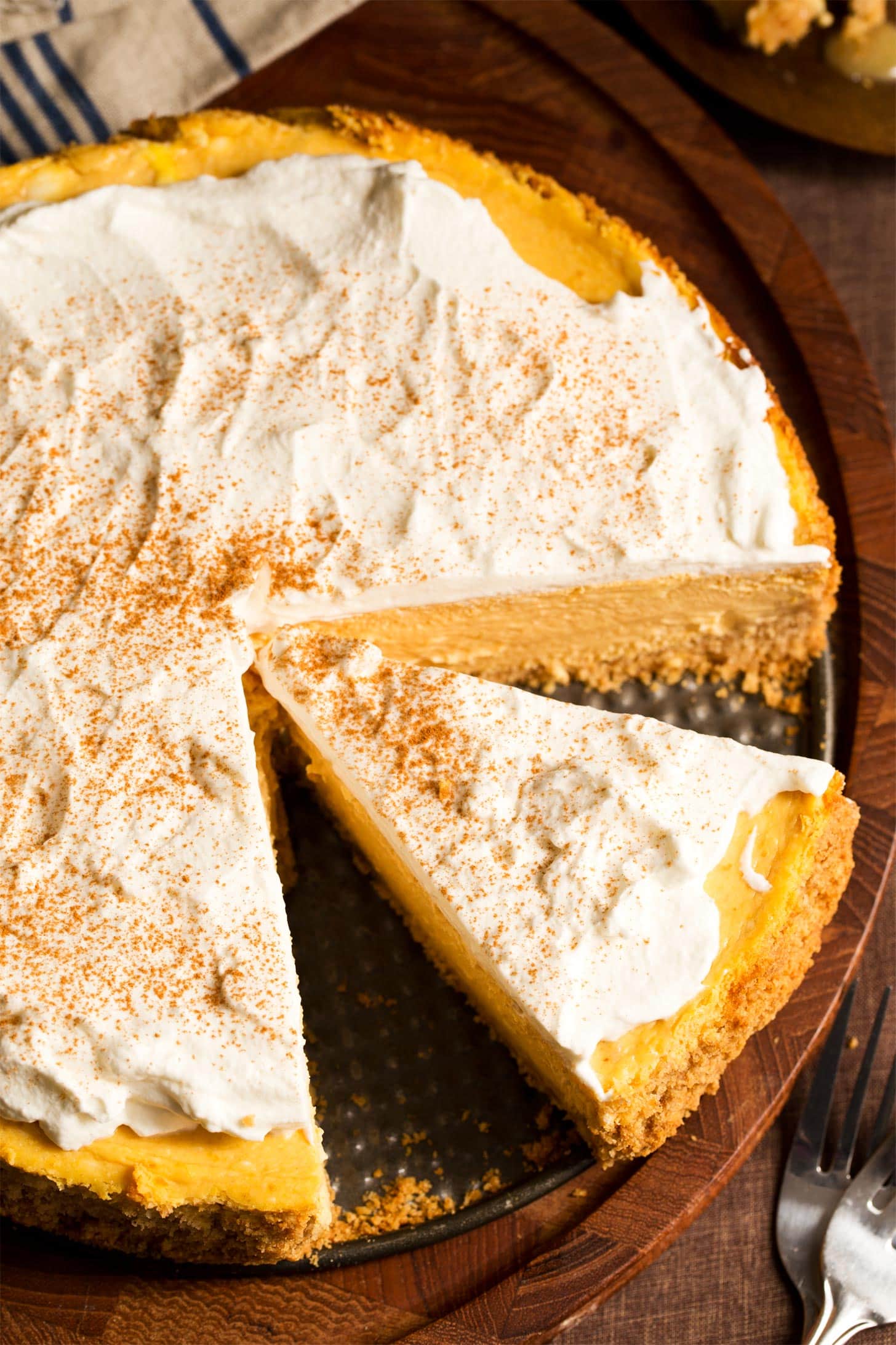 Overhead shot of pumpkin cheesecake with slice cut