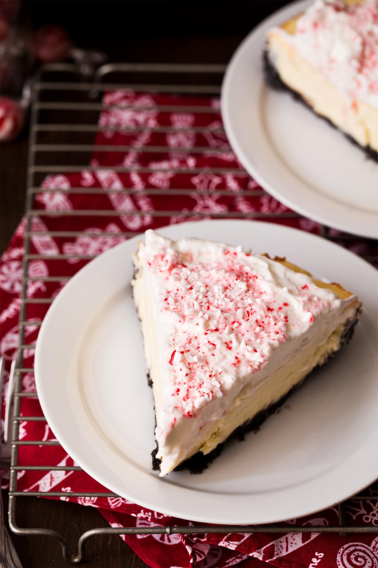 Slice of Christmas cheesecake with peppermint candy canes